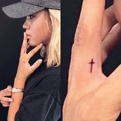 Sofia Richie Cross Finger Tattoo | Steal Her Style Little Cross Tattoos, Cross Tattoo On Hand, Cross Finger Tattoos, Thumb Tattoos, Heart Tattoo On Finger, Small Cross Tattoos, Cute Finger Tattoos, Cross Tattoos For Women, Finger Tattoo For Women