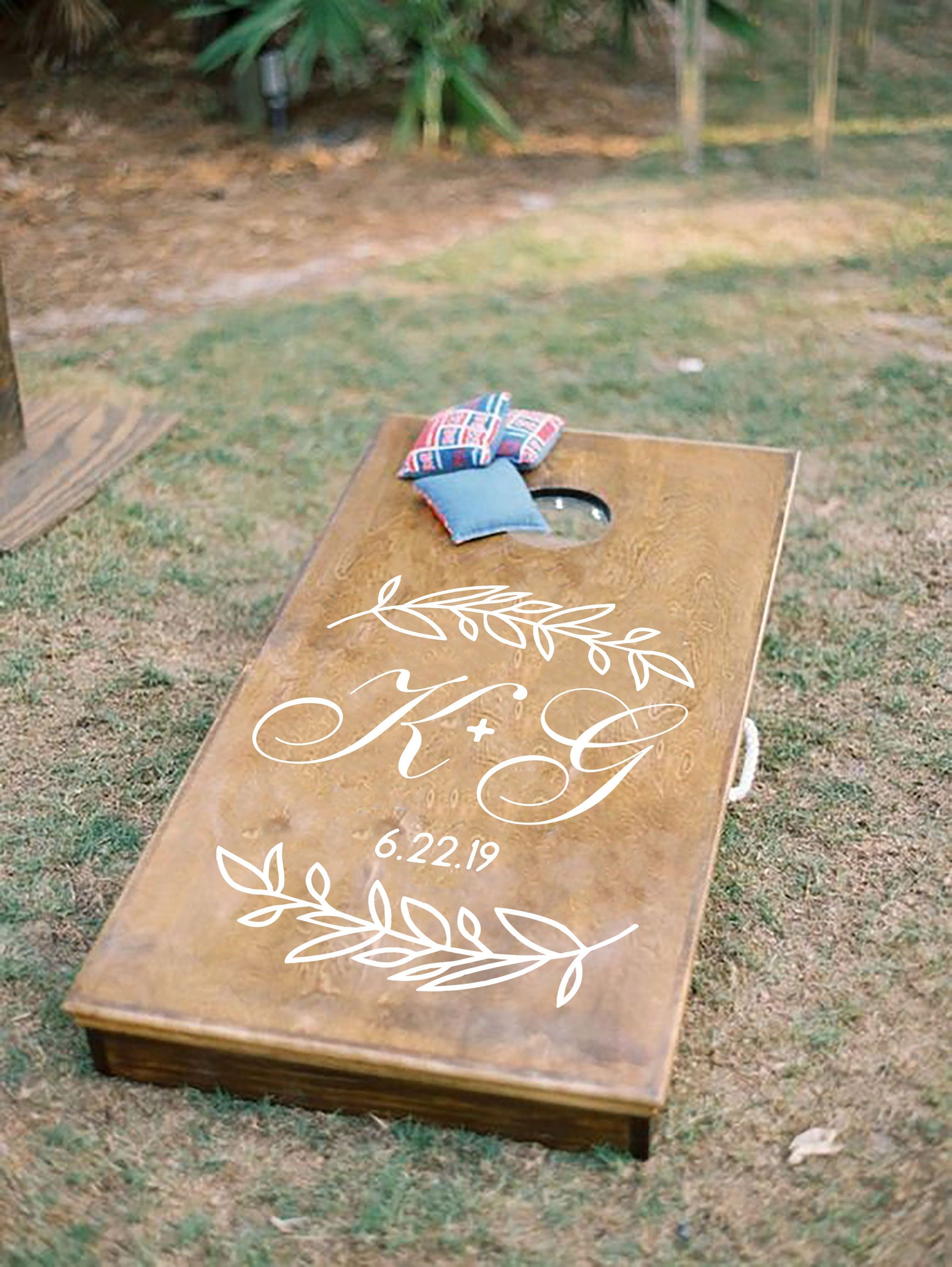 "Want Custom Wedding Cornhole boards that you're guests can enjoy during your cocktail hour or reception? What a fun decal that can easily be removed in the future but looks great for years! Customize the board with your initials and wedding date. *sale is for decals only. You would have to adhere decals to corn hole boards you already have. 📦Contents📦 self-adhesive Custom Initial Monogram decal Matte wall decal with transfer tape Size/Quantity of decal (please choose on checkout) Installation Wedding Games, Wedding Reception Decorations, Wedding Signs, Reception Ideas, Wedding Cornhole Boards, Cornhole Board Decals, Custom Cornhole Boards, Custom Wedding Monogram, Sentimental Wedding
