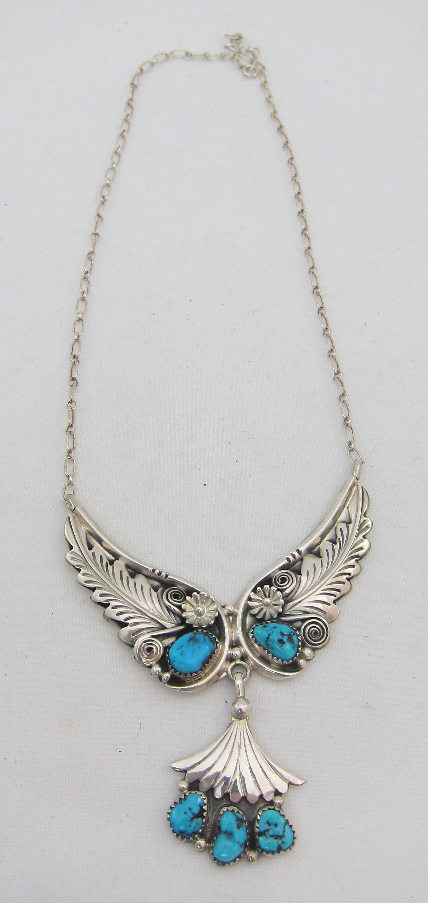 Silver leaf necklace with a turquoise dangle