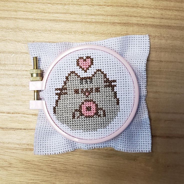I've been debating if I should spend the money on Stitch People and supplies so I decided to try a mini cross stitch first to see if I like it. I made some errors but overall I'm happy with my Pusheen! Kawaii Cross Stitch, Tiny Cross Stitch, Cross Stitch For Kids, Beaded Cross Stitch, Cross Stitch Embroidery, Fuse Bead Patterns, Modern Cross Stitch Patterns, Cross Stitch Designs, Pokemon Cross Stitch Patterns