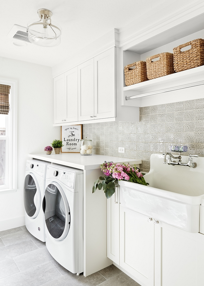 Laundry room Featuring custom white and an utility sink, this