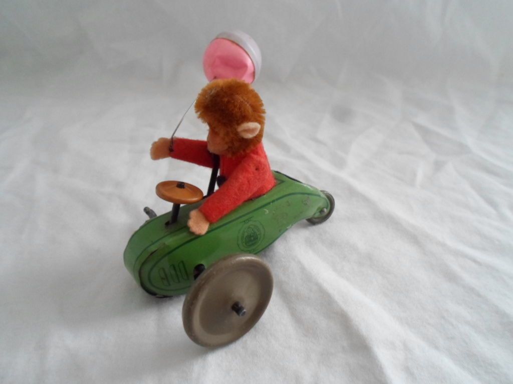 This is a fairly rare Schuco Monkey in a car w/balloon. He sold for $338.00 despite the missing