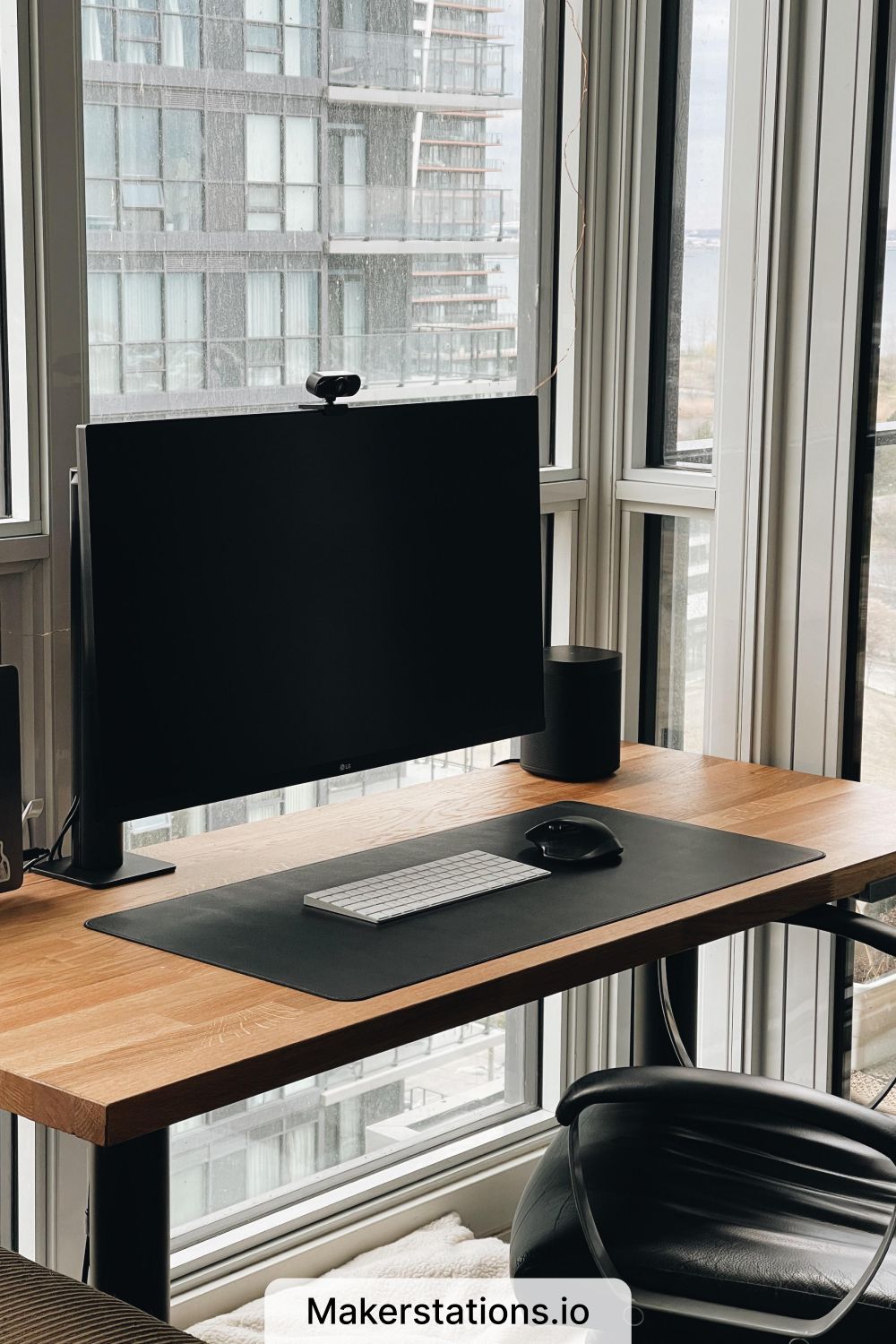 A Clean, Minimal Standing Desk Setup with a City View