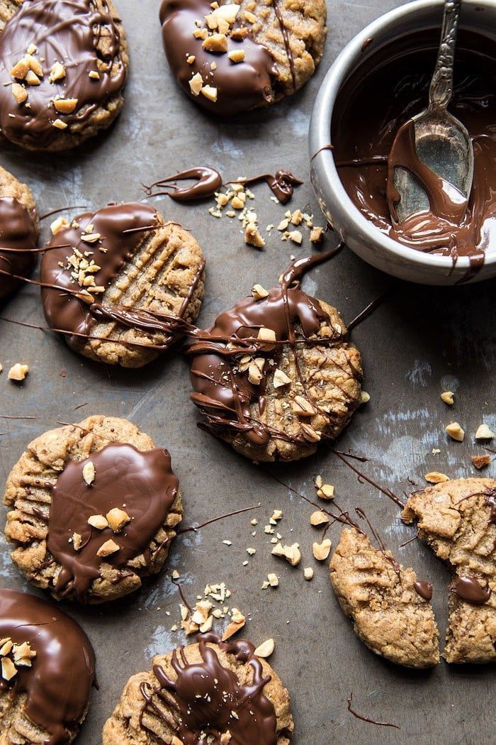 5 Ingredient Chocolate Dipped Peanut Butter Cookies: So easy, and no butter, no sugar, and no flour. Dates are the secret ingredient here, not only do they replace the sugar, but they make the cookies moist and delicious! @halfbakedharvest.com