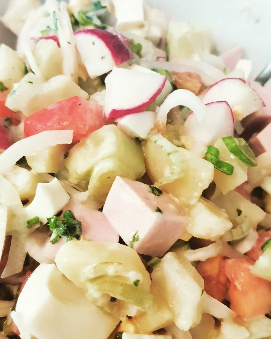 Love the russian kitchen Okroschka - this is a typical russian summer salad/soup Well yes as a recipe varies from home to the next home- this is what i put in there. Tomato and green onion Potatoes !!! Cucumber and radishes Sausage some parsley eggs and for the dressing or better called