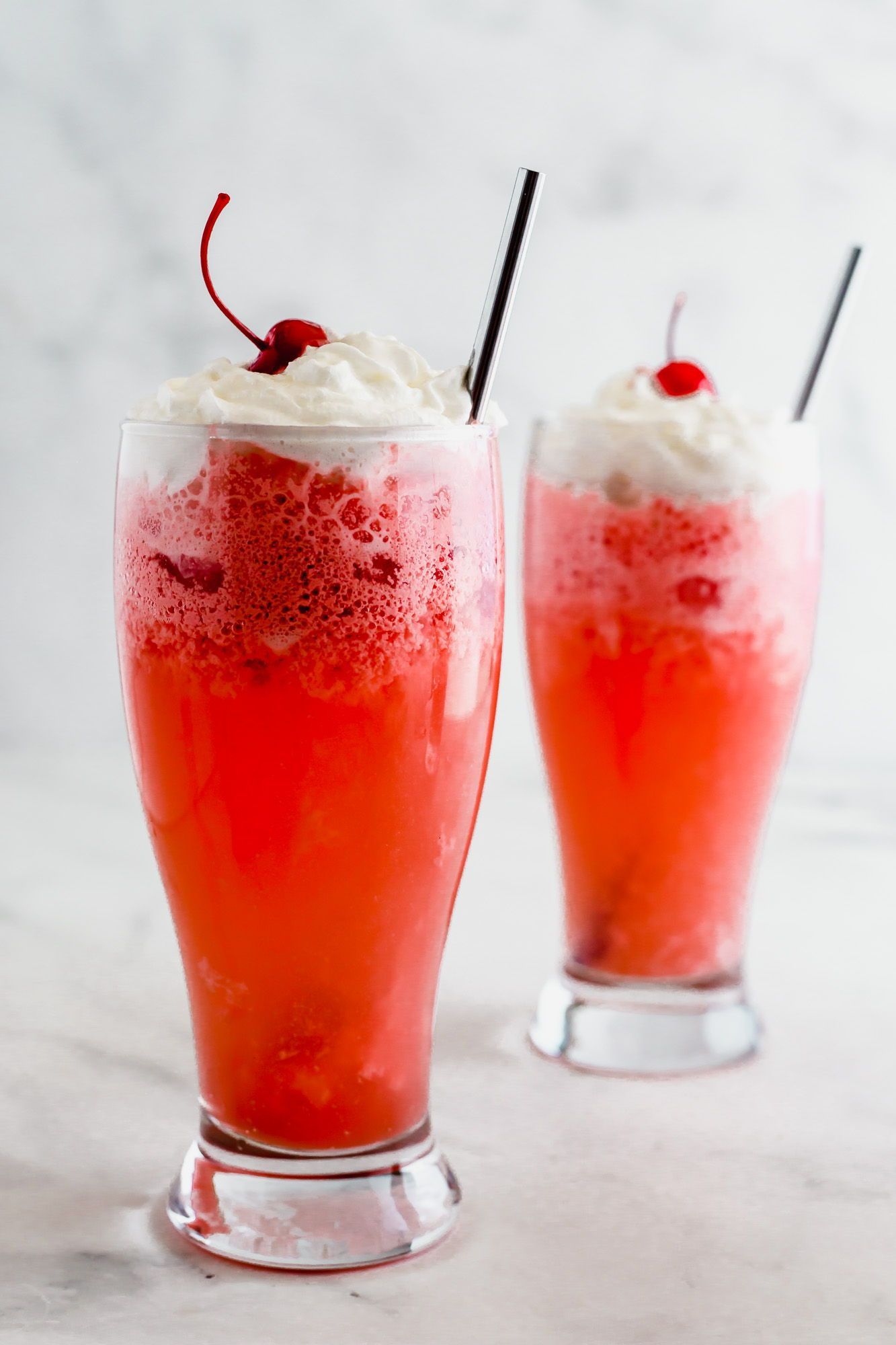 Vanilla Raspberry Italian Cream Soda made with vanilla and raspberry syrup, cream and club soda. It’s a refreshing and festive drink perfect for any holiday, party, or special occasion! #italiancreamsoda #partydrink Raspberry Lemonade, Raspberry Vanilla, Whipped Cream Drink, Italian Cream Soda, Italian Drinks, Vanilla Syrup, Maraschino Cherry, Inspired Recipes