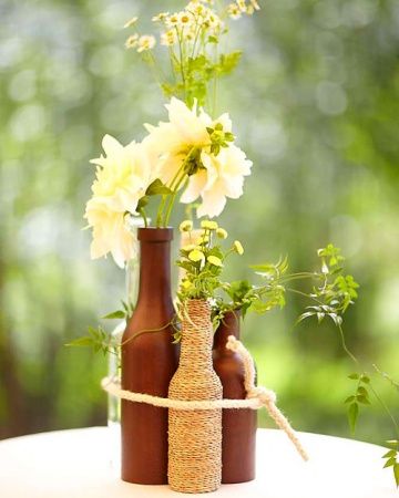 A Casual Outdoor Green Wedding In New York Wine Bottle Centerpieces Bottle Centerpieces Spray Painted Bottles