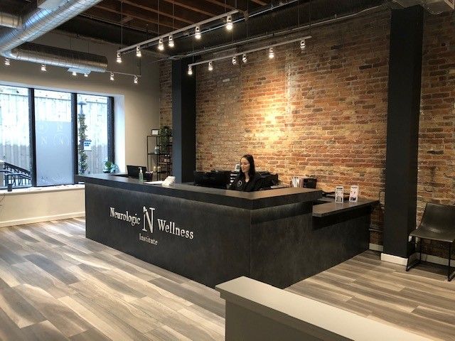 Black Front Desk With Exposed Brick Chiropractic Office Design Lobby Black Front Desk With Exposed Brick, Industrial Reception Desk Design