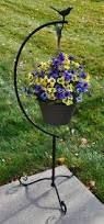 Resultado de imagen para porta maceta de hierro para jardin