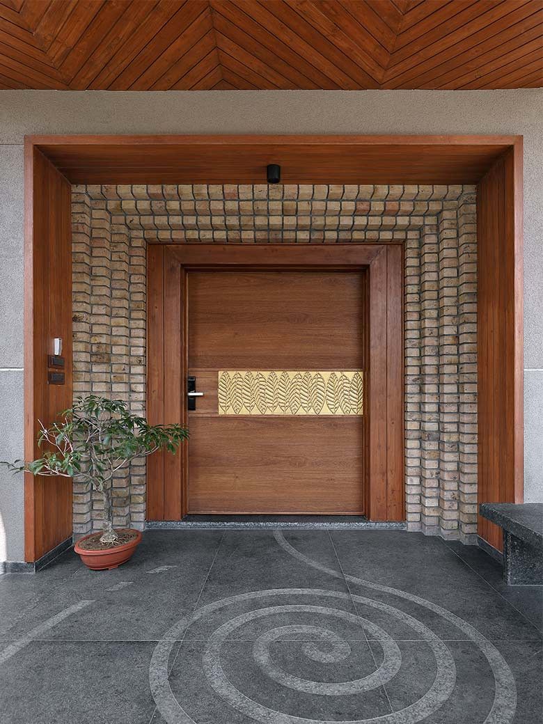 This 8500sqft Gujarat house embraces the India Modern design with a twist! | Goodhomes.co.in Modern Entrance Door, Main Entrance Door Design, Front Door Design Wood, Front Gate Design, House Entrance, House Front Gate, Entrance Ideas, Entrance Doors, Gate Designs Modern