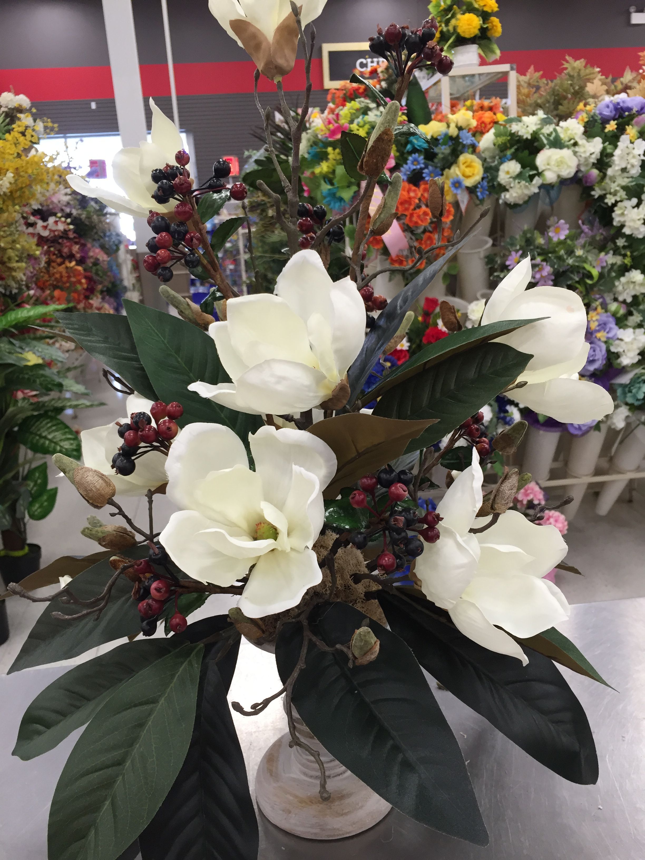 Magnolia and berry arrangement | Floral arrangements ...