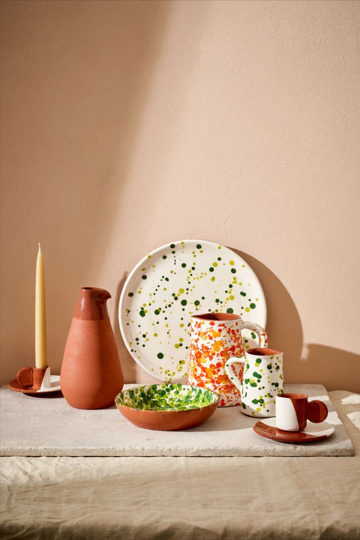 Terracotta plate, bowl, jugs and tableware with orange and green splatter design. Ceramic Tableware, Ceramic Pottery, Artisan Pottery, Hand Thrown Pottery, Egg Cups, Pottery Pieces, Coffee Pot, Jugs, Minimalist Design