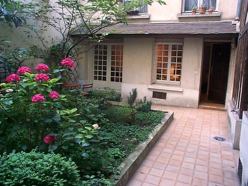 Courtyard Garden View Apartments View from courtyard toward apartment door (open) and