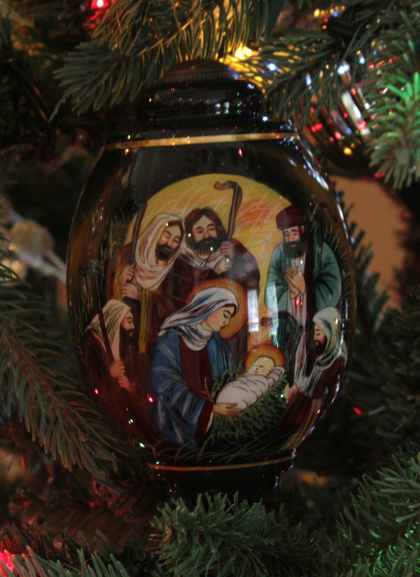 this nativity scene ornament is hand painted using an ancient