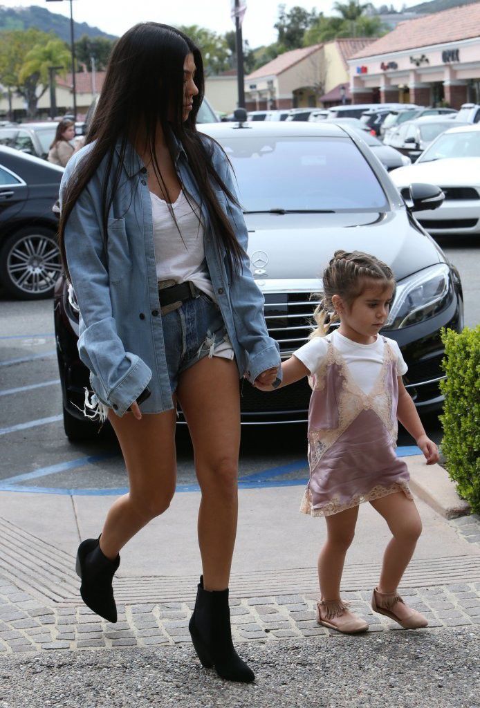 Kim Kardashian carries North and Saint Mote, Kardashian Fashion, Kardashian