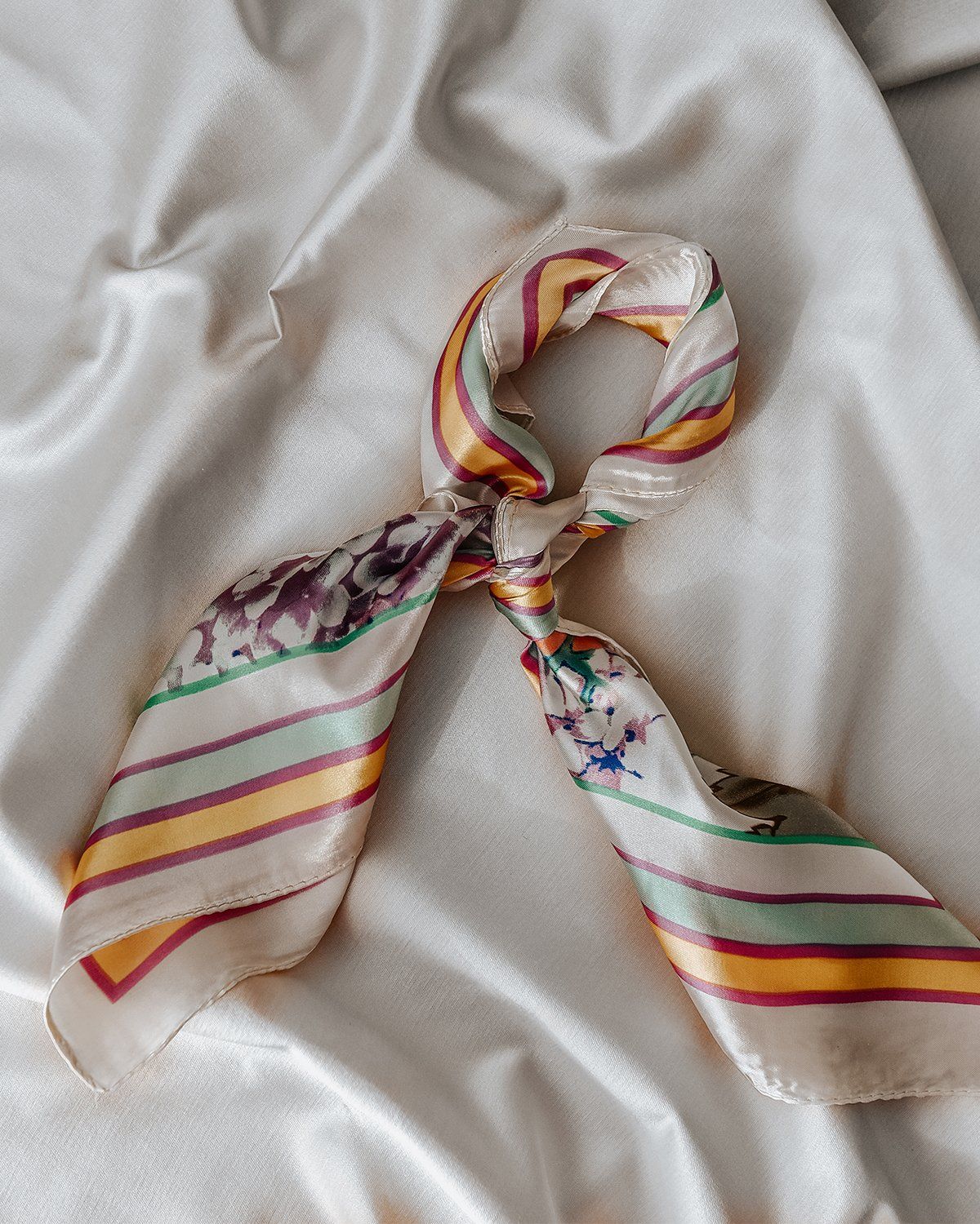 Super silky scarf featuring a floral and candy stripe print. Perfectly versatile, the Honora is the easiest way to elevate an outfit. She's one of our smaller sized scarves - the best size to tie around a ponytail or to wear as a neck scarf. Our scarves also make the perfect sustainable gift wrap (and they double up as an extra gift!). Self tie scarf Tie around your ponytail, your neck or use as sustainable gift wrap Square scarf measures 60cm x 60cm Handwash only Head Scarf Tying, Tie Scarf, Silk Scarf Hair, Silky Scarf, Make A Tie, Honora, Sustainable Gifts, Candy Stripes, Neckerchiefs