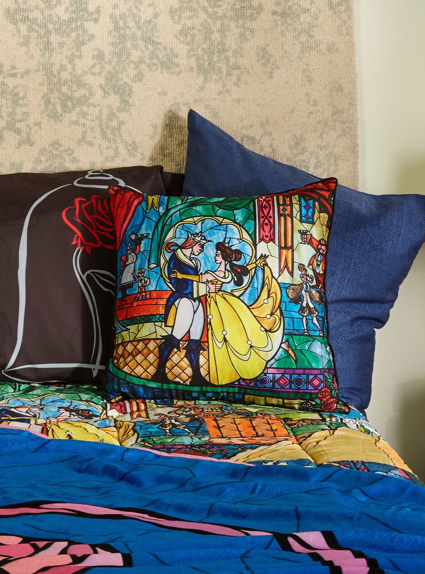 add some color to your castle decor with this square throw pillow from disneys beauty and the beast pillow features a stained glass style design of belle