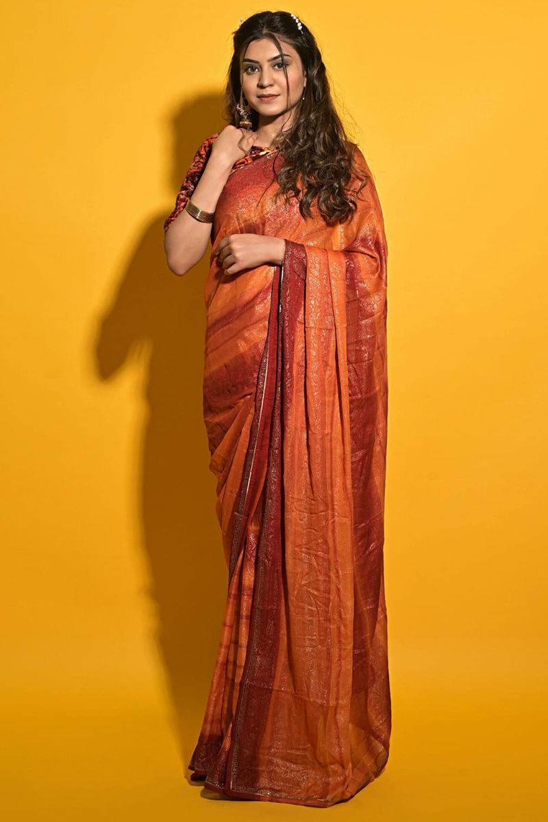 Specifically designed for a stylish lady like you is this orange crepe saree which will make you look very subtle yet edgy.This round neck and half sleeve blouse is elaborated using printed work.It is along with crepe saree in orange color beautified with printed and stone work.This blouse can be customized up to the maximum size available in inches 44 around the bust.
Slight color variation may occur due to photographic reasons. Crepe Saree, Stone Work, Printed Sarees, Ladylike, Half Sleeves, Elaborate, Orange Color, Edgy, Reasons