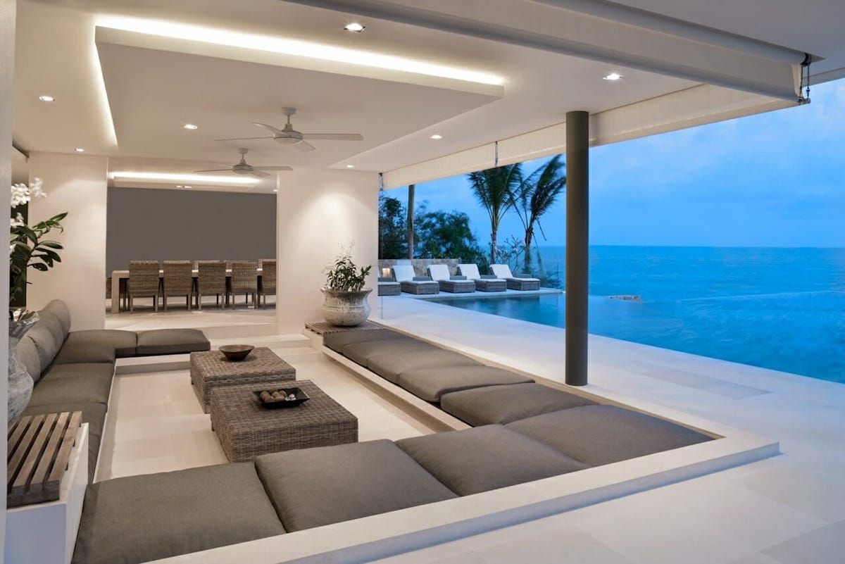 Take advantage of structural design to add a minimalist seating arrangement. Not only does it appeal to the contemporary eye, but it also happens to be less maintenance and clutter. Poolside Dining, Poolside Decor, Pool House Decor, Pool Decor, Mantra, Porches, Dimmable Ceiling Lights, Poolside Furniture, Interior Design Consultation
