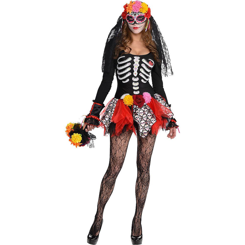 a woman dressed in a skeleton costume with flowers on her head and