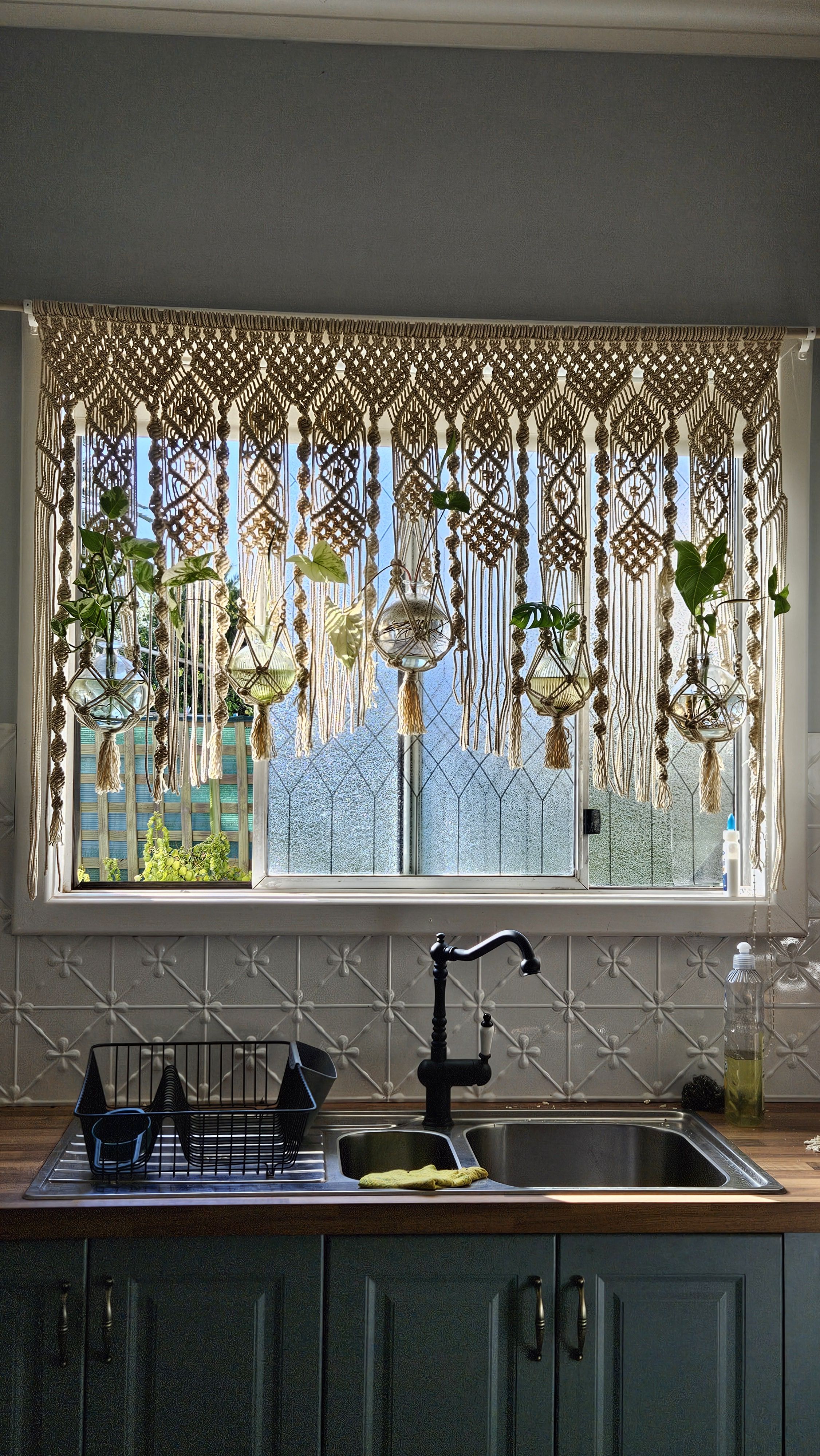 macrame curtain with plants