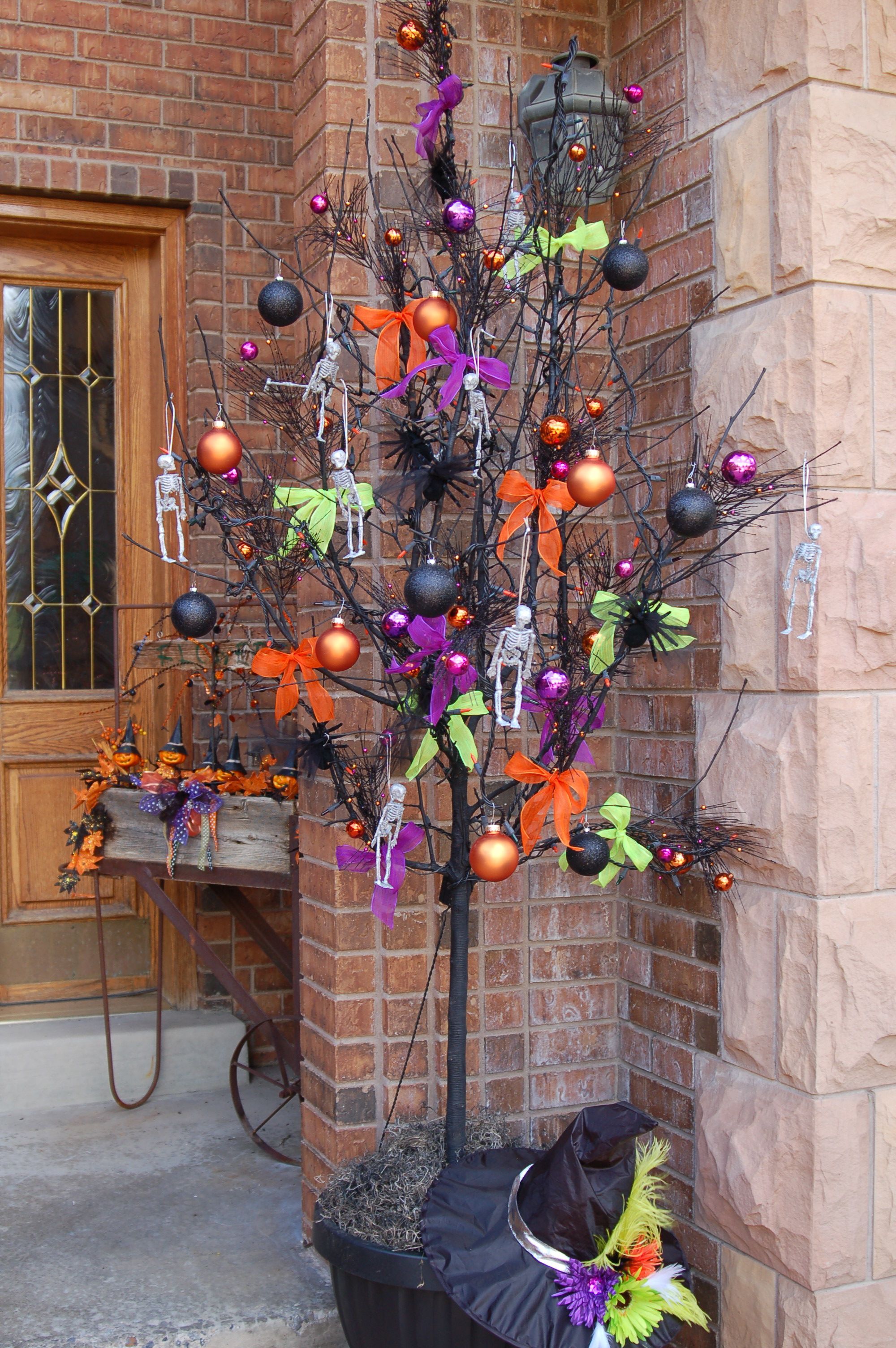 A dead tree spray painted black and made into a halloween tree - halloween tree decoration A dead tree spray painted black and made into a halloween tree - halloween tree decoration