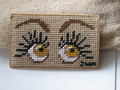 Eyes Can See You. Zoe wrote, "This is a glasses case. So cute, right! The face is originally made for someone for green eyes but I went with a golden yellow. That's my logo right to the right! This took me several hours to complete-a simple joy." Plastic Canvas Coasters, Plastic Canvas Stitches, Plastic Canvas Ornaments, Plastic Canvas Patterns Free, Plastic Canvas Crafts, Modern Cross Stitch, Cross Stitch Patterns, Eyeglass Cases Pattern, Checkbook Covers