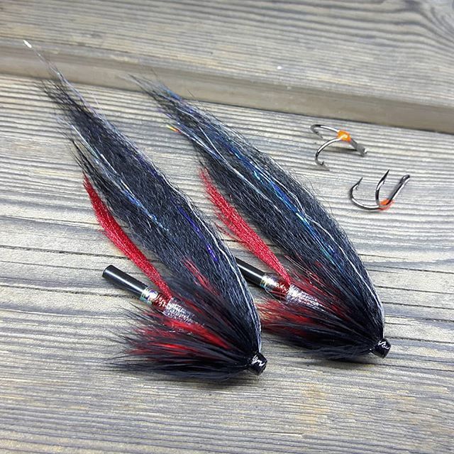 Black silver and red. If I ever have to go fishing big Browntrout I will try these Black silver...