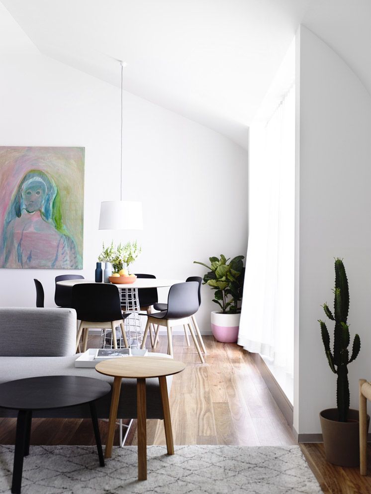 Visit A Modern Melbourne Apartment With Striking Lines Dining Small Modern Dining E With Cacti And Pastel Artwork Melbourne Apartment Living Es