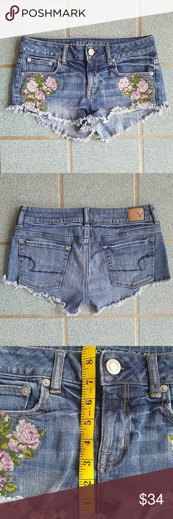 American Eagle Floral Stretch Denim Cutoff Shorts American Eagle distressed denim cutoff shorts, size 2. Stretch denim, pink and green floral embroidered on front, frayed hem. 99% cotton, 1% elastane. Measurements in photos. Great condition overall. American Eagle Outfitters Shorts Jean Shorts #denimcutoffshorts