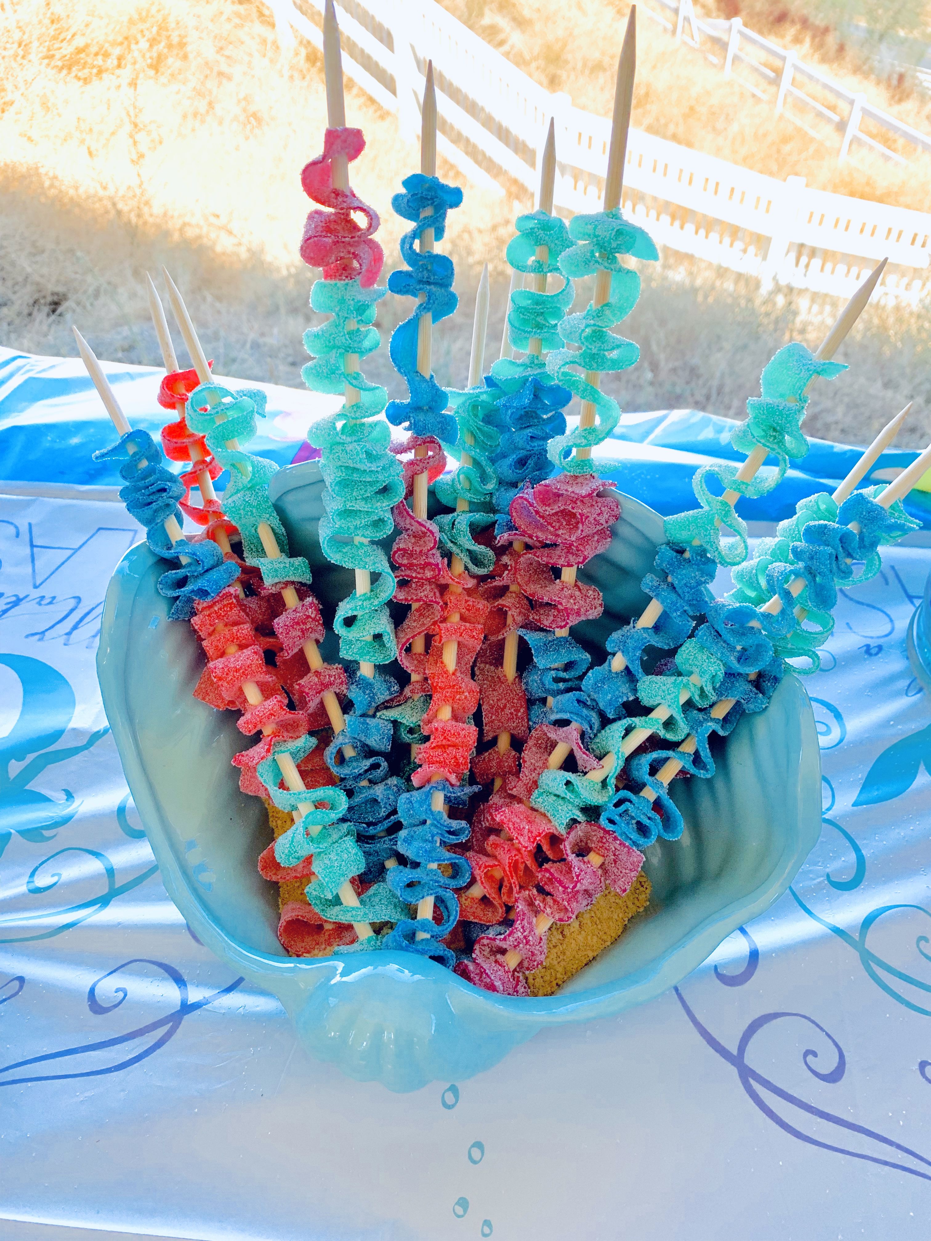 Loved these Sea Coral Candy sticks we made for our under the sea themed birthday party. Click to see how my daughters third birthday party turned out, along with links to everything I purchased to have it come together. #Ariel #LittleMermaid #Birthday #Party #UnderTheSea #MomLife #Celebrate #MomBlog #LifestyleBlog #Ursula #Coral Mermaid Birthday Party Food, Mermaid Theme Party, Little Mermaid Birthday, 6th Birthday Parties, Birthday Party Decorations, Third Birthday, Sea Themed Party Food, Mermaid Snacks Parties Food, Mermaid Party Decorations