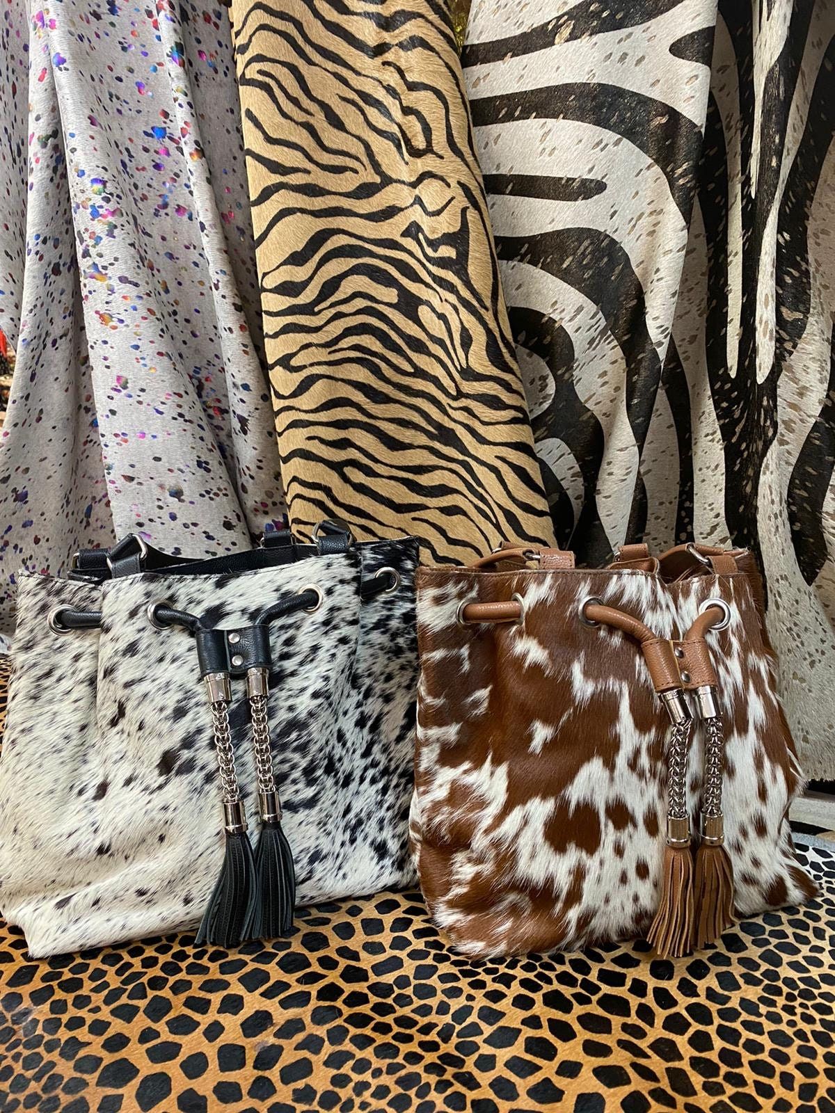 "Over the shoulder, Cowhide leather bag is perfect for any occasion!! very unique. The inside fits your must-haves perfectly such as your keys, phone and etc.... Message us if you have questions, or if you would like for us to send you more pictures! Size: 16\" x 12\"" Cowgirl Accessories, Purse Accessories, Purse Jewelry, Leather Tote Purse, Leather Purses, Cow Leather, Cowhide Leather, Cowhide Decor, Upcycled Purse