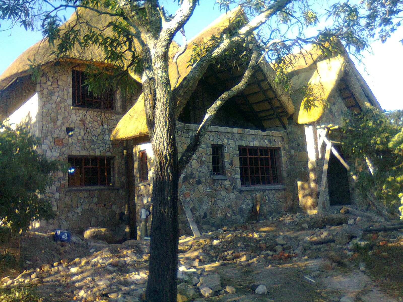 Nyanga zimbabwe stone under thatch thatched house peaceful home zimbabwe cottage ideas