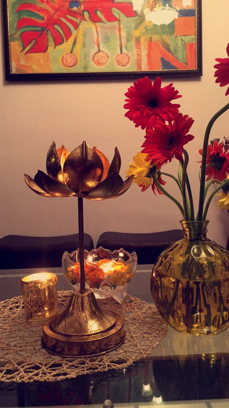 Table center piece decor for diwali. Fresh flowers. Bronze