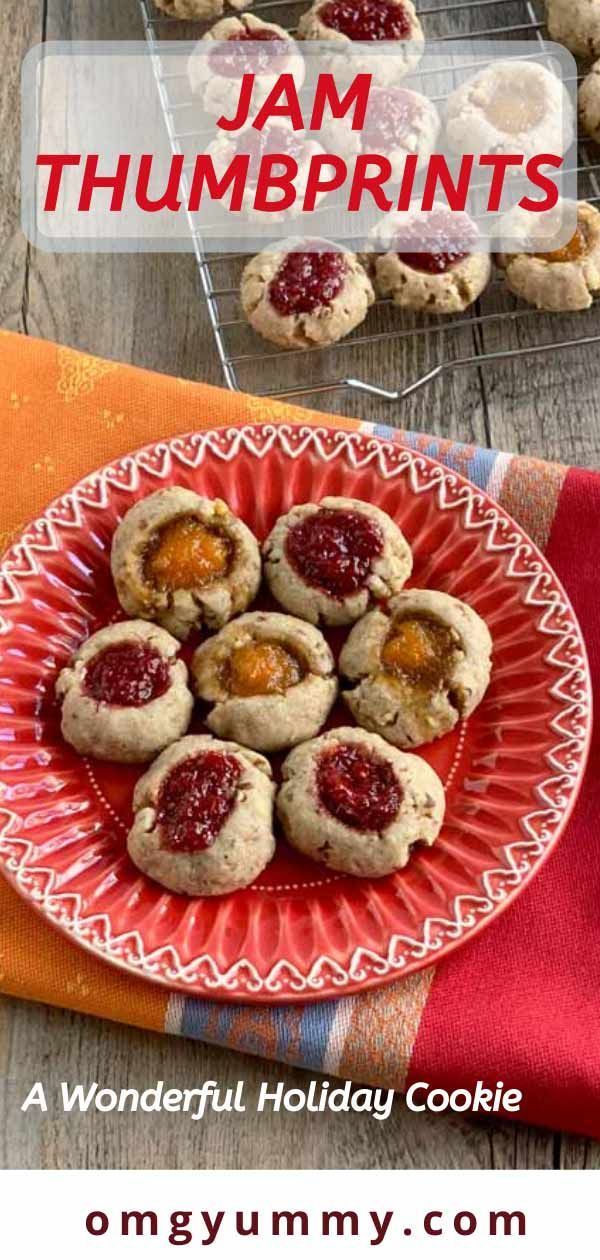 Jam Thumbprints #jamthumbprintcookies Jam thumbprint cookies are a simple, versatile and really tasty holiday cookie. In fact, why wait for the holidays - these are delicious and easy to make all year round. The dough in this version is half flour, half pecans and spiced with a bit of cinnamon and other warm spices of your choosing. Fill with homemade jam or your favorite store-bought versions. Minimal sugar and effort yield maximum flavor! #jamthumbprints #cookies #holidaycookies #homemadejam # #jamthumbprintcookies
