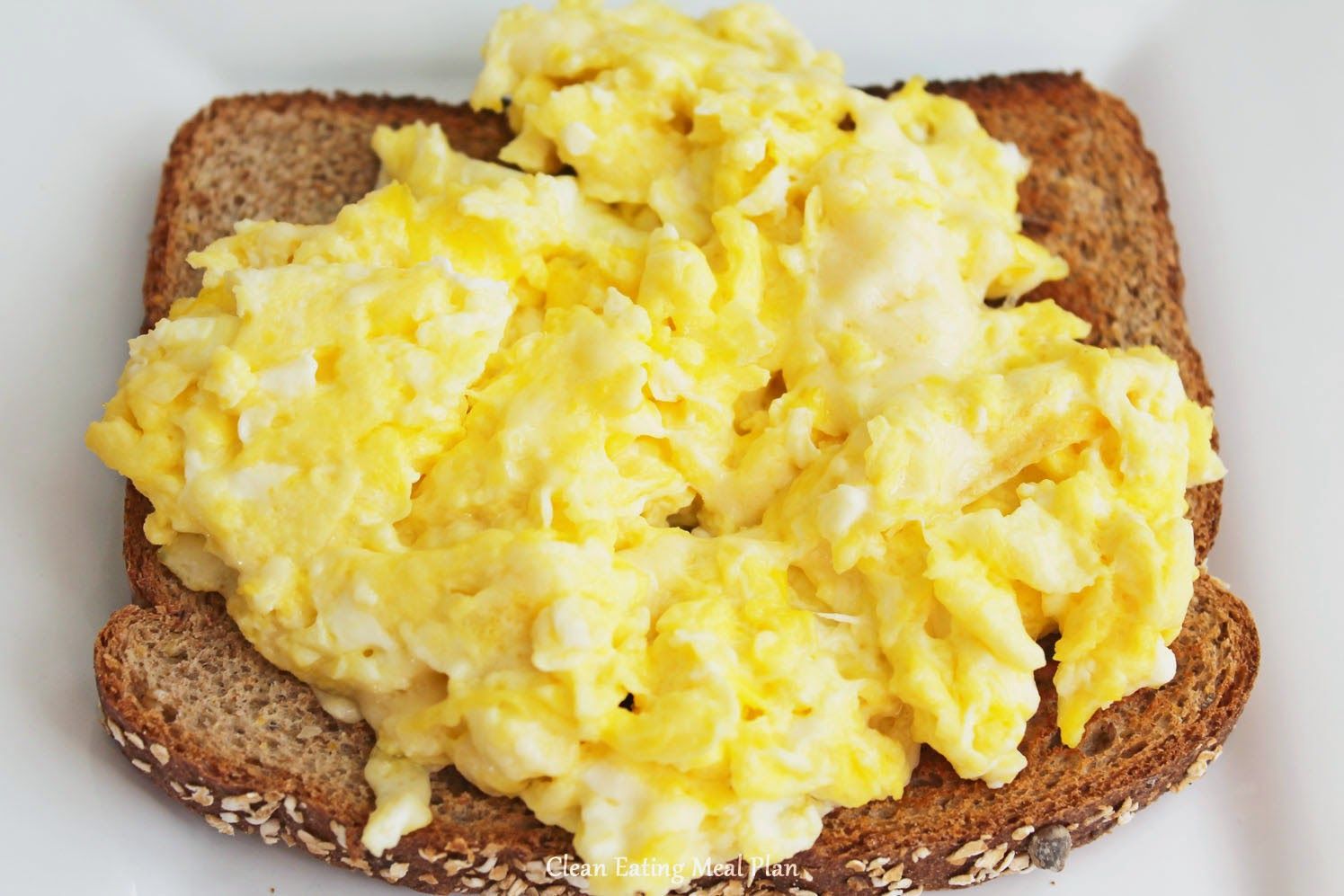 Healthy Breakfast Scrambled Eggs With All Natural Colby Jack Cheese And Real Butter Over Whole Wheat Toast