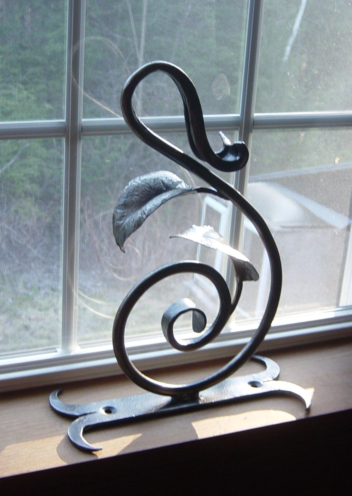 A plant hanger or maybe something else... hand 042413 Metal