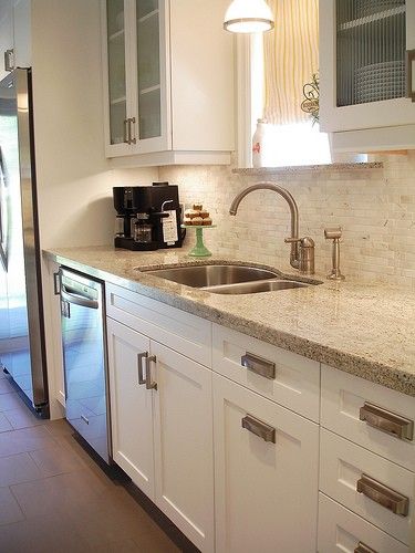 Backsplash With Ornamental White Granite Countertops White