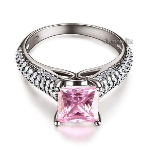A Gorgeous Princess cut Lab Created diamond engagement ring. This ring is hand made and itsstones are each individually hand set by master jewelers. Ring size is 5 - 9 and is made from solid 925 Sterling Silver. Ring Size Available: US size 5, 5.5, 6, 6.5, 7, 7.5, 8, 8.5, 9 Main Stone Size: 7mm (1.5 Carat) Main Color: Black Pink Main Stone Color: Fancy Pink Main Stone Shape: Princess Cut Metal: Solid 925 Sterling Silver Hallmark: 925 Plating: 3-Layers Black Gold Plated (It is not 100% Pure Black Engagement Anniversary, Anniversary Rings, Lab Created Diamond Rings Engagement, Metal Solid, Diamond Jewellery, Lab Diamonds, Stone Settings, Princess Cut, Solid 925 Sterling Silver