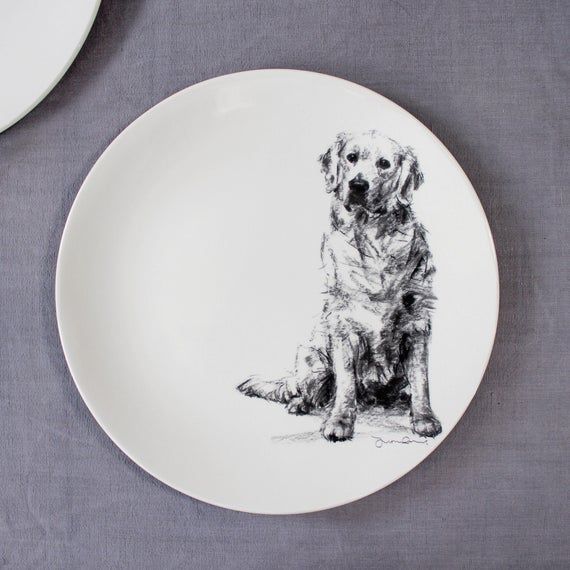 Small plate featuring a golden retriever. Perfect as a side plate or breakfast plate - or as a collectable to display!dimensions H2cmW23cm (9inch)Made from high fired earthenware in Stoke on Trent, England, these beautiful plates feature charcoal sketches by Justine Osborne. Off white in colour.Artwork applied by hand using decals.Dishwasher and microwave safe. Golden Retriever Drawing, Golden Retriever Gifts, Dog Breakfast, Breakfast Plate, Poodle Drawing, Dog Drawing, Black Cocker Spaniel, Charcoal Sketch, Dog Sketch