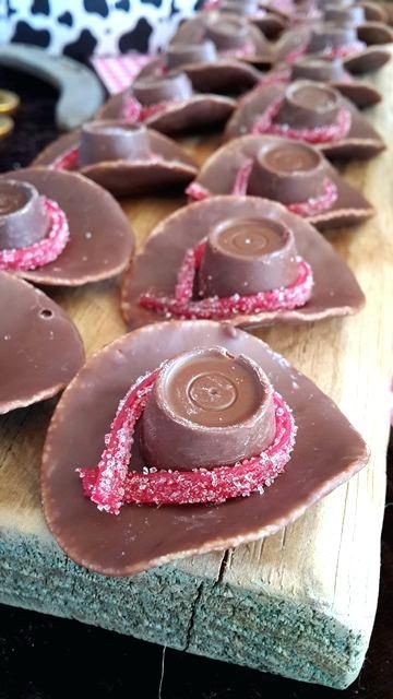 Chocolate Cowgirl or cowboy hats for a wild west birthday party #kidsbirthdayparty #kidsbirthdaypartyideas #girlbirthdayparty #girlbirthdaypartyideas #boybirthdayparty #boybirthdaypartyideas #cowboysandcowgirls