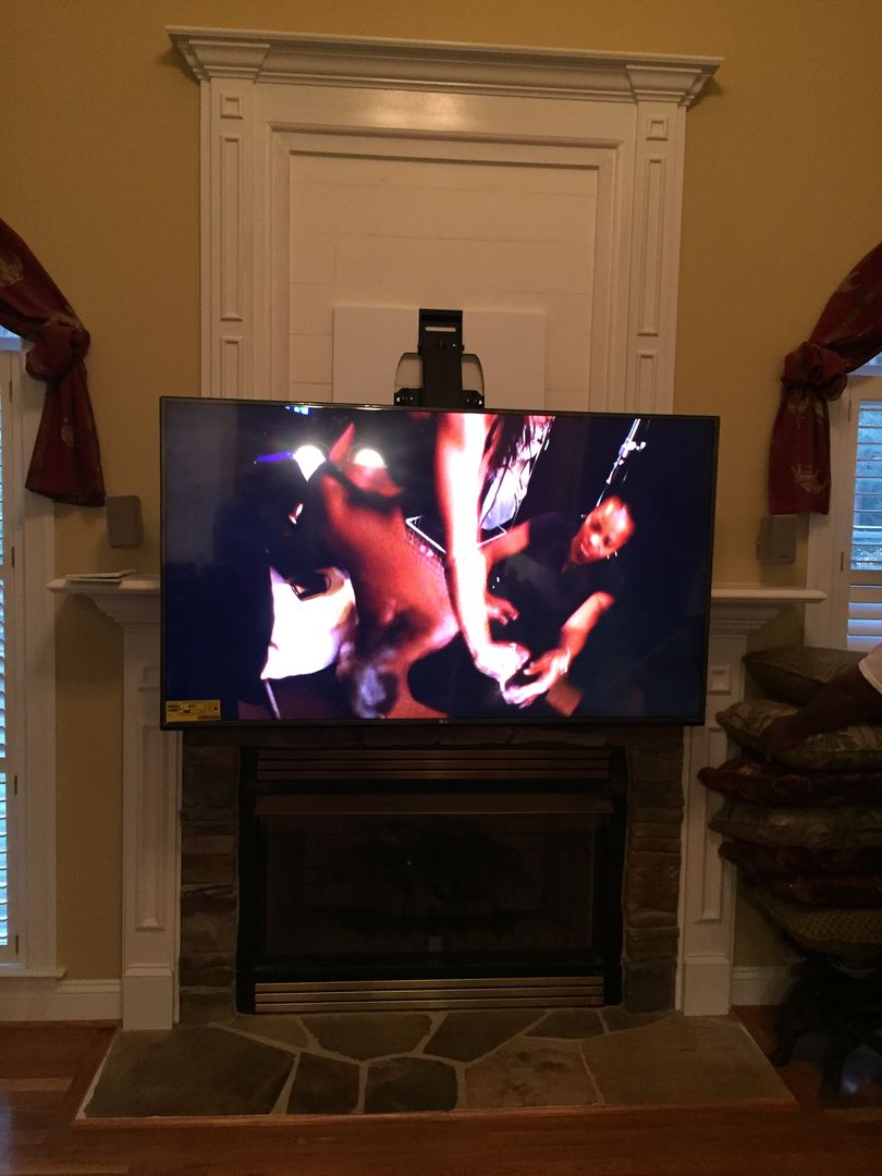 Mounting Flat Screen TV Covering Old Fireplace Niche | Charlotte, NC Tv Mounted Above Fireplace, Fireplace Built Ins, Mounted Tv, Tv Covers, Wooden Fireplace, Hanging Artwork, Living Room Tv Wall, Ocean Colors, Diy Home Improvement