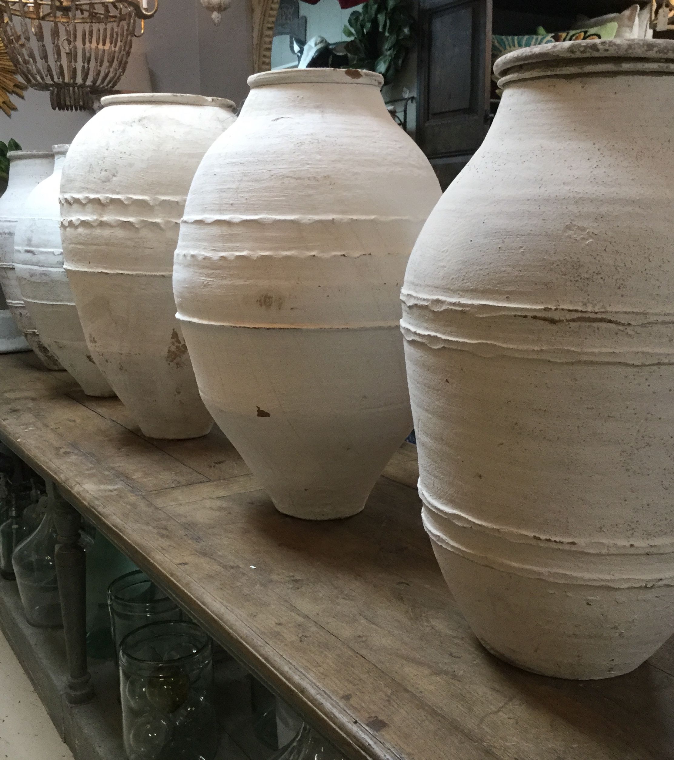 Large vintage olive jars from Europe displayed in our shop Olive jar
