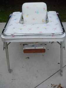 oh yeah we went from the high chair to this stupid looking table