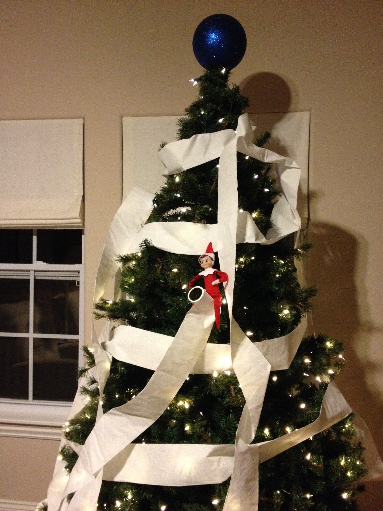 our elf wrapped our tree in toilet paper oh no the next day he had re wrapped the roll in a basket with a note that he had slightly tree holiday decor