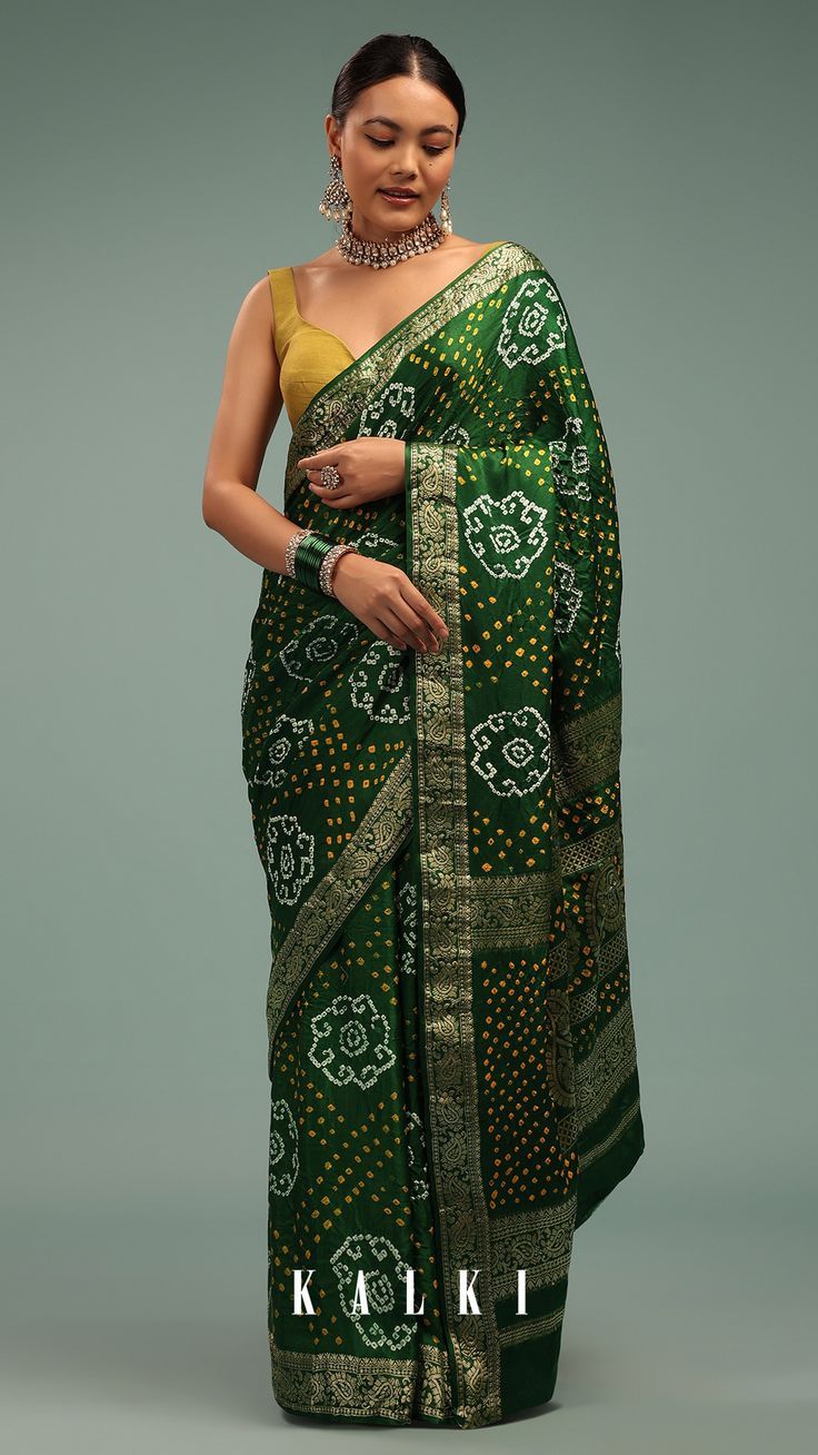 Flaunt your royal walk, wearing our authentic evergreen green bandhani saree. The saree is fabricated in silk with banarasi handweaving. The saree has a delicate woven embroidery in zari buttis work over the pallu. Bandhani Saree, Kalki, Green Saree, Flaunt, Evergreen, Authentic, Woven, How To Wear, Delicate