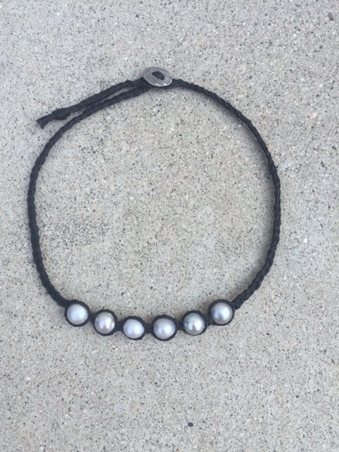 Short black beads and braided wire necklace.