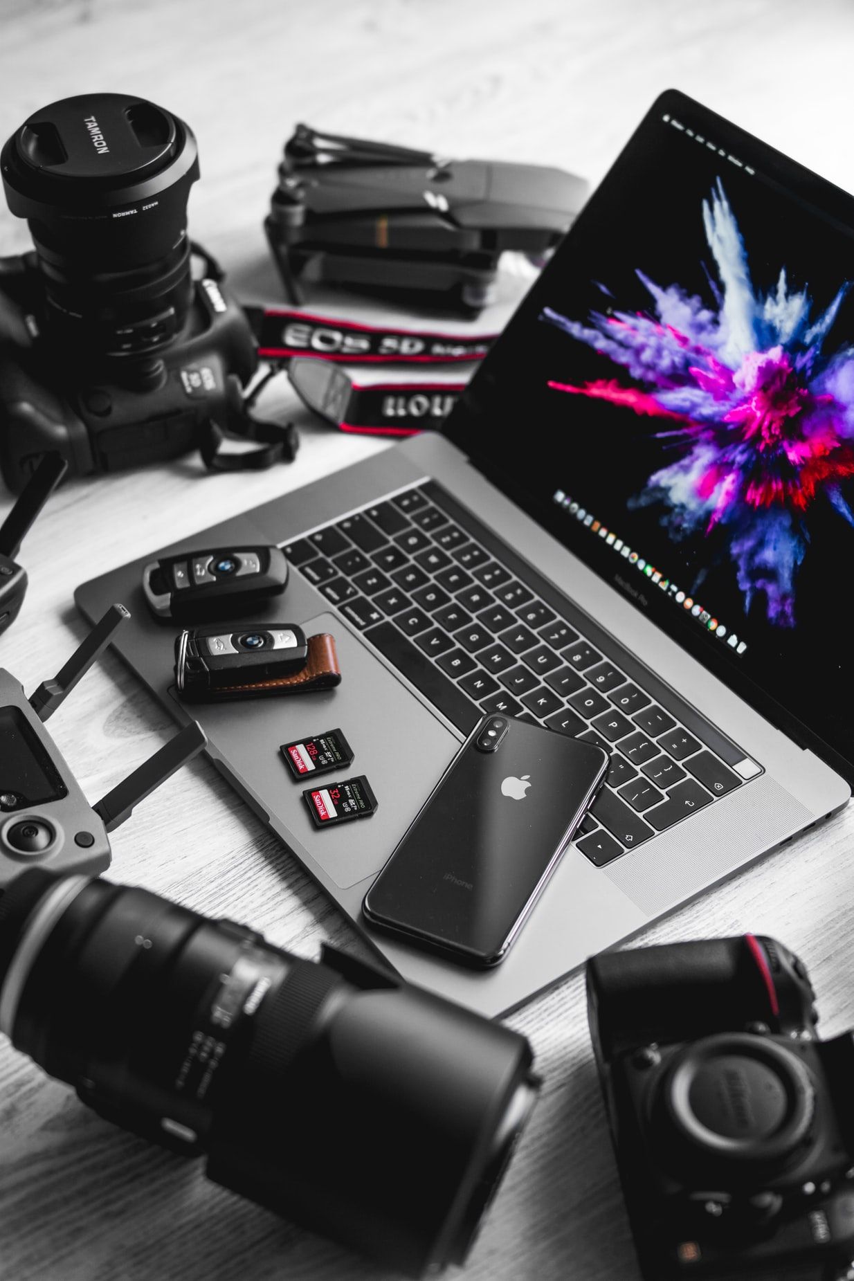 Laptops With The Best Cameras MacBook Pro beside DSLR camera photo – Free Computer Image on Unsplash