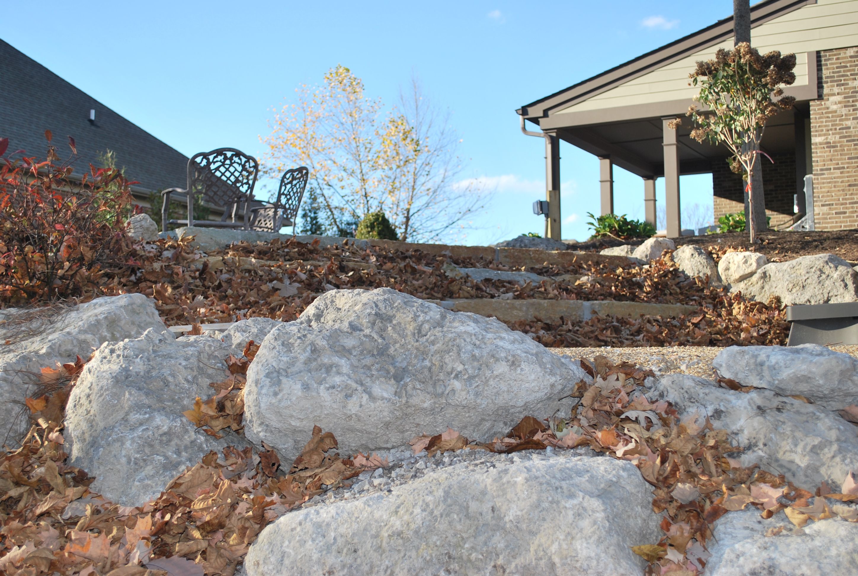 Rocks frame in your outdoor living space and add a warm ... Rocks frame in your outdoor living space and add a warm ... on Rock And Stone Outdoor Living id=52305
