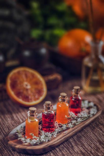 Close-Up Of Essential Oils In Bottles On Table